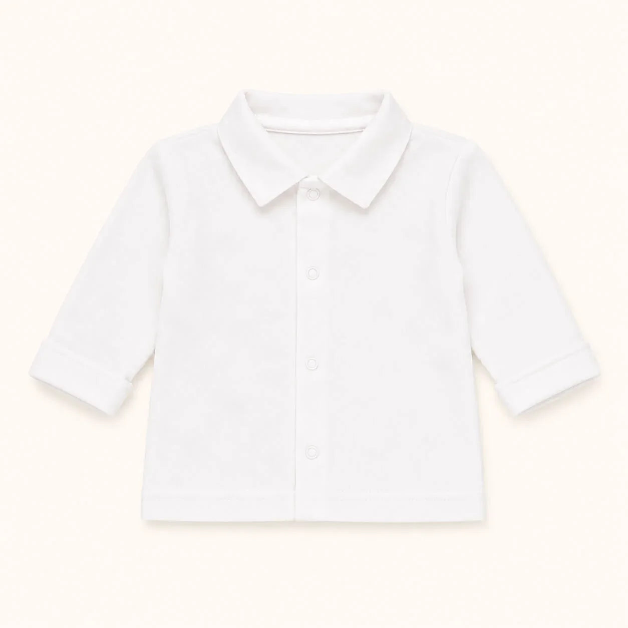 Camisa branca de bebé com botões e gola, ideal para enxoval confortável e suave