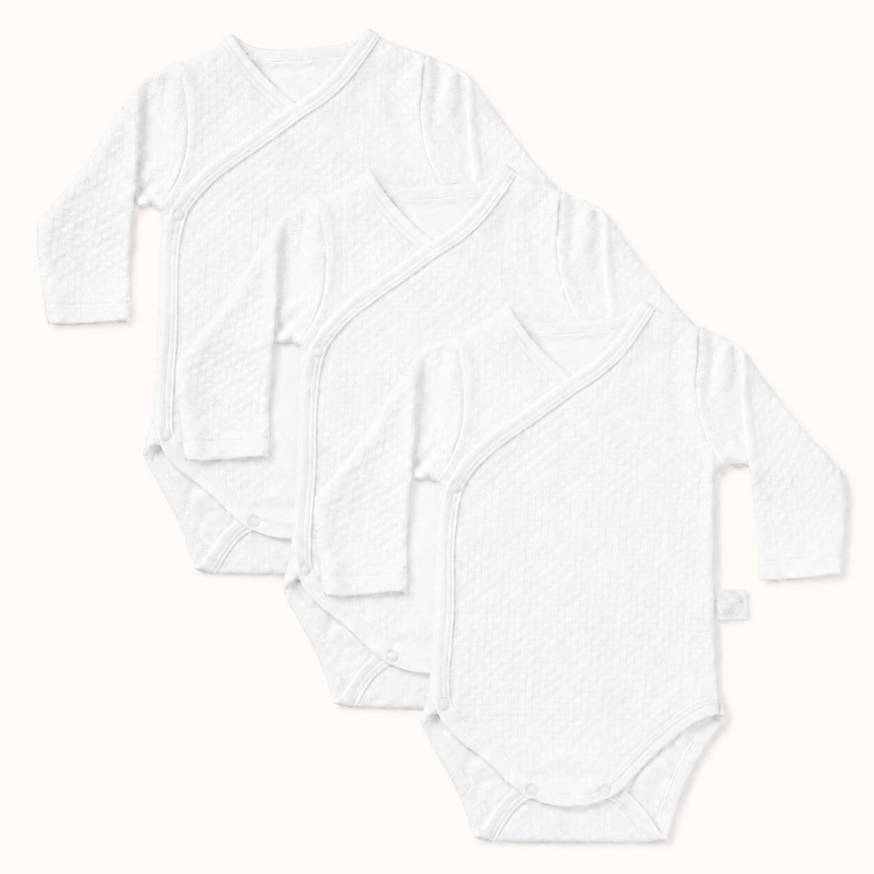 Conjunto de 3 bodies cruzados em malha algodão fantasia branco