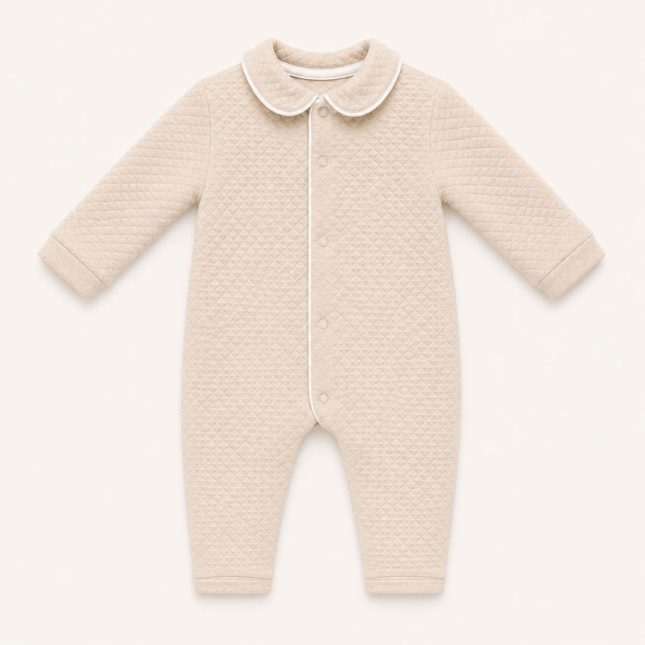 Babygrow sem Pés em malha losango, a abrir à frente e nas duas pernas, para facilitar a muda de roupa bem como a fralda