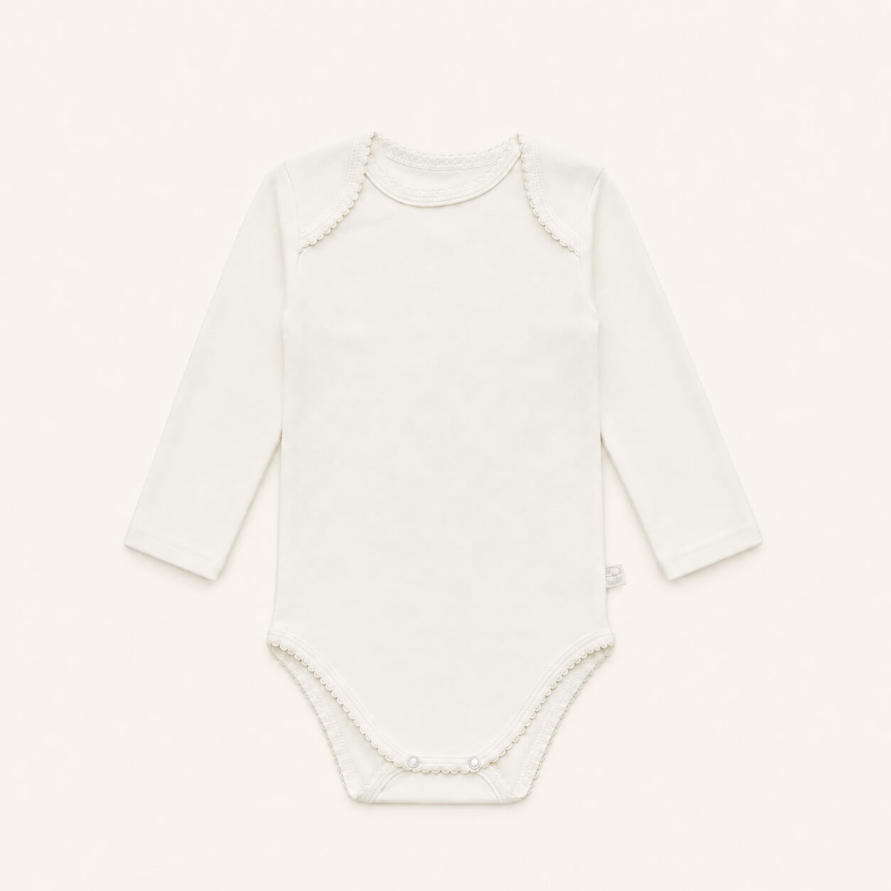 ​Body cava americana para bebé em 100% algodão Interlock bege. Sem etiquetas no decote, anti-pilling e ultra resistente