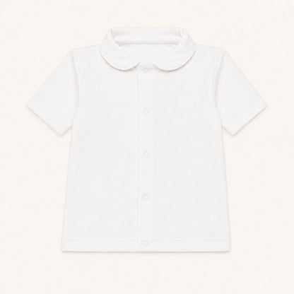 camisola com gola redonda em malha algodão branco, ideal para bebés de 12 meses aos 48 meses, no verão. Sem etiquetas irritantes no decote e abrir de cima a baixo para facilitar a muda da roupa.