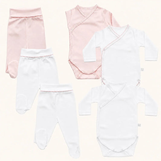 Conjunto de 3 bodies cruzados e 3 calças com pés para bebé menina em algodão conposto por um conjunto rosa, outro branco com pormenores rosa e o último em branco