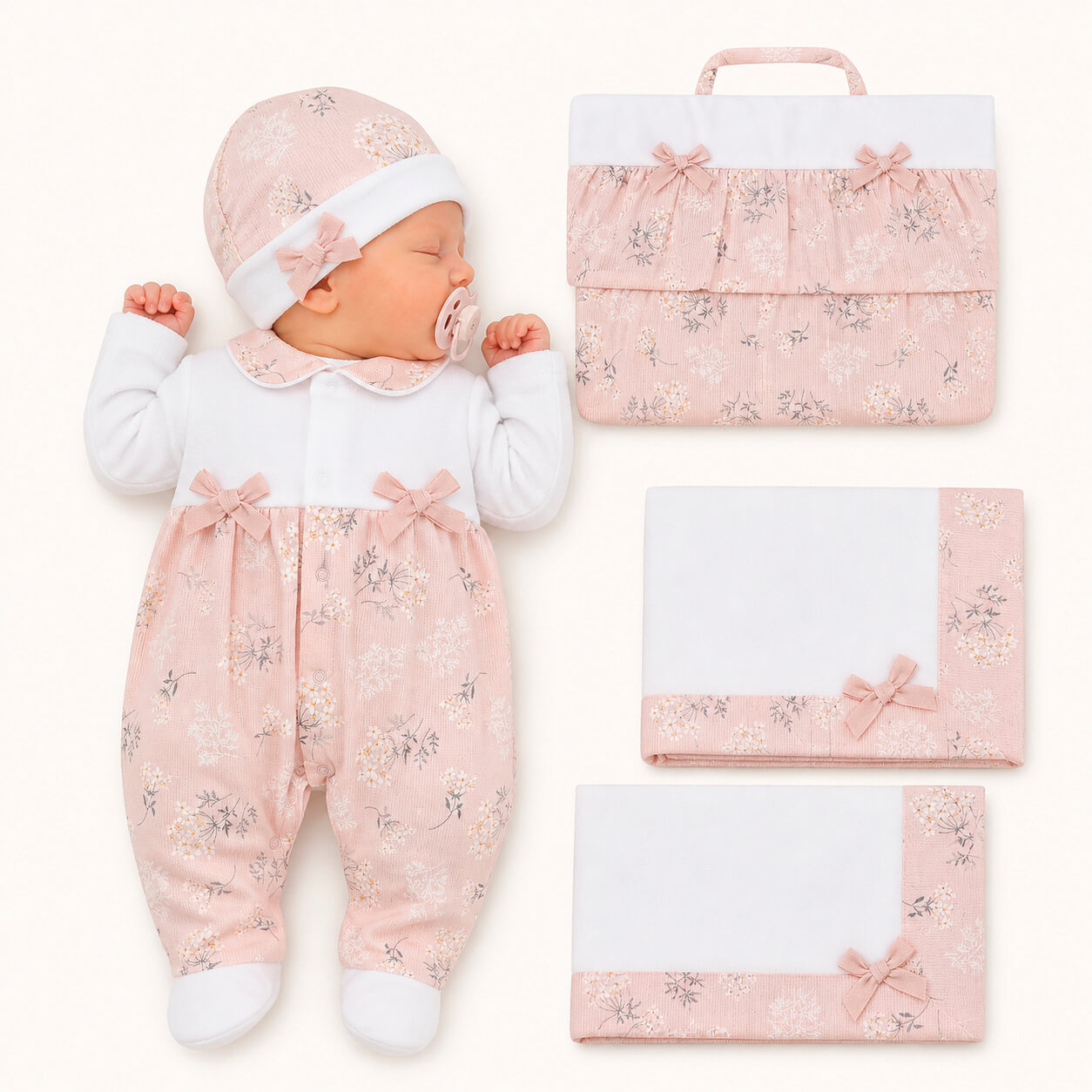 Conjunto de primeira roupa para bebé, branco e coral, com touca, laços e padrão floral.
