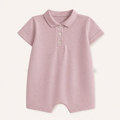 Macacão de bebê em algodão piquet rosa velho com gola polo e botões