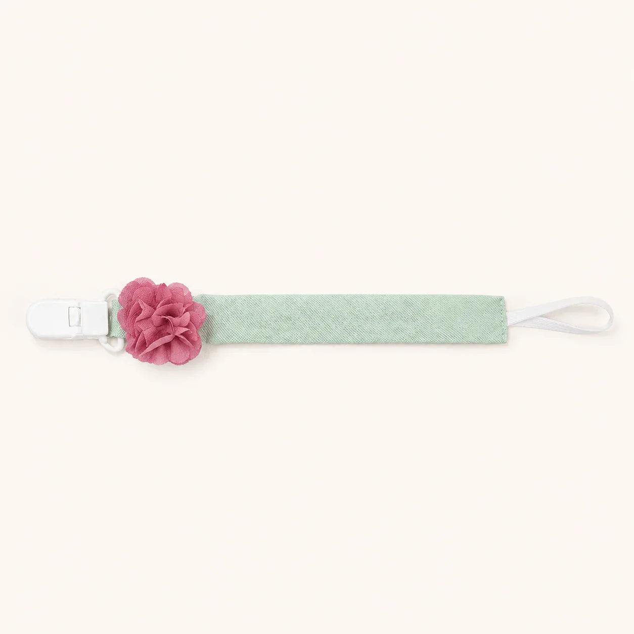Suporte de chupeta verde com detalhe de flor rosa, acessório para bebé.