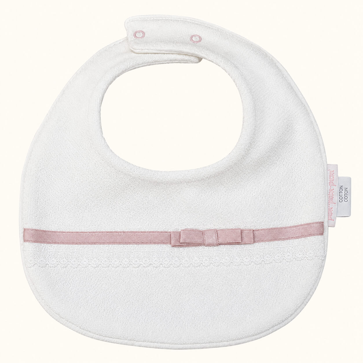babete malha algodão romantic bege com fita e laço rosa velho, ideal para os bebés mais pequenos por ser mais macia e delicada.