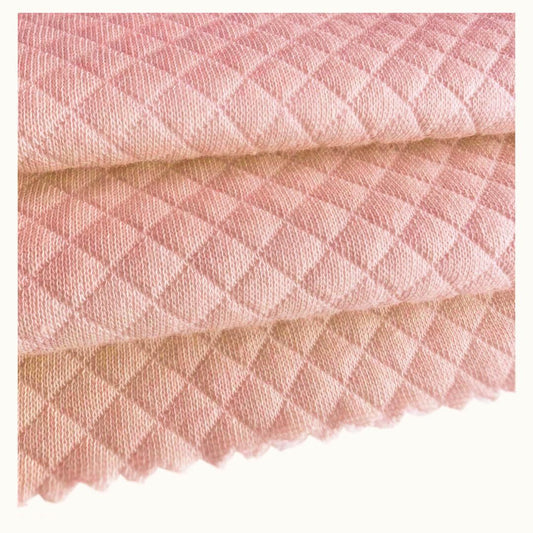 Manta e cobertor rosa velho com textura de losangos em malha macia para bebé