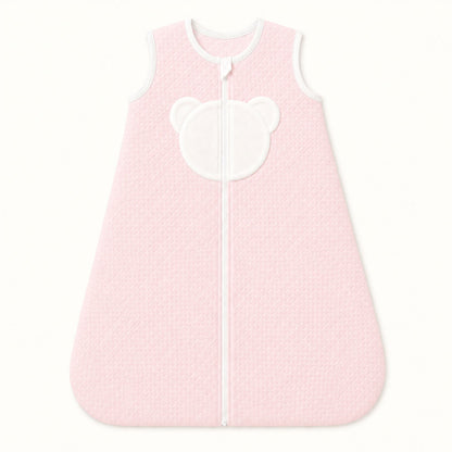 Saco de dormir rosa para bebé com detalhe de urso branco, ideal para recém-nascidos