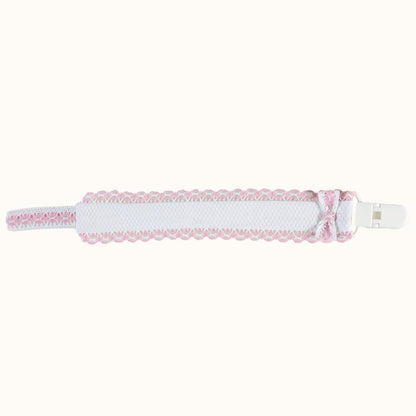 Suporte de chupeta branco e rosa com detalhe rendado e presilha para bebé